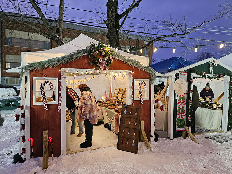 People shopping at a vendor stall during Christmas in Montrose, PA.