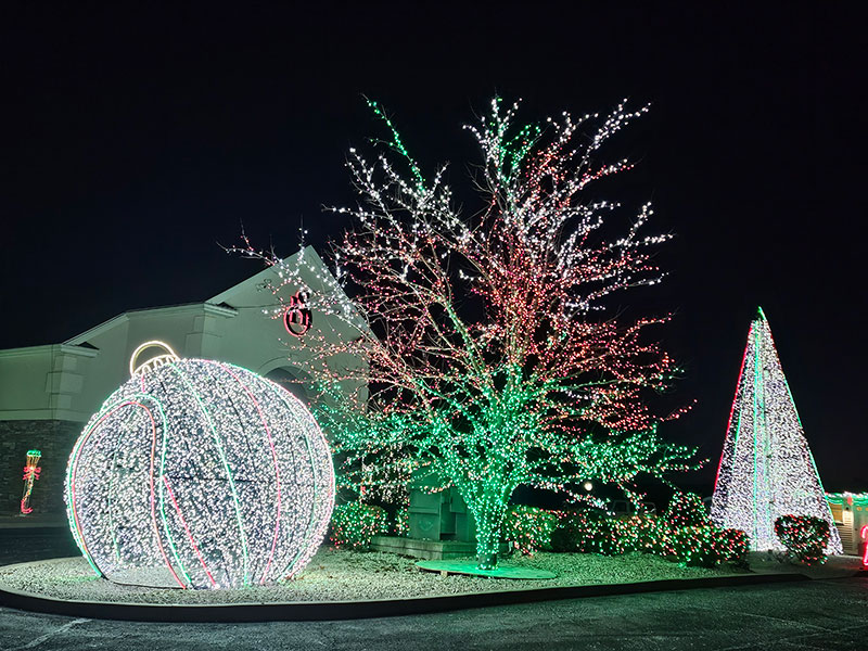 A tree and a giant ornament mark the entrance of Festival of Lights at Stone Hedge Golf Course in Tunkhannock, PA.