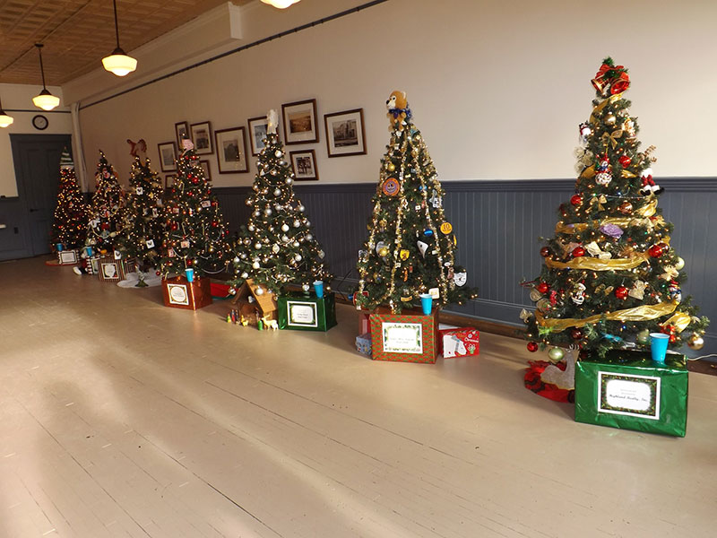 Trees line the wall during Tree Fest at Christmas in Dushore, PA.