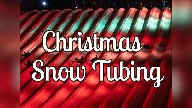 Promotional image for Christmas Snow Tubing showing a brightly lit red-and-green tubing hill with riders sliding down under festive lighting at Blue Mountain Resort.