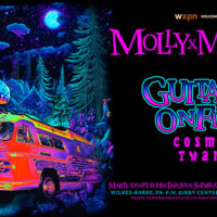 Marty Stuart & Molly Tuttle: Cosmic Twang Guitars on Fire concert poster for the F.M. Kirby Center for the Performing Arts in Wilkes-Barre, featuring psychedelic artwork, colorful typography, and the show title text.