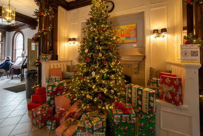 A Christmas tree and presents at the 2025 Artisans' Marketplace at the Waverly Community House