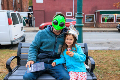 A father and daughter dressed alien attire pose for the camera at the second annual Carbondalien Festival in Carbondale, PA.