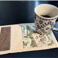 A handmade mini rug for mugs made at Johnson College in Scranton, PA