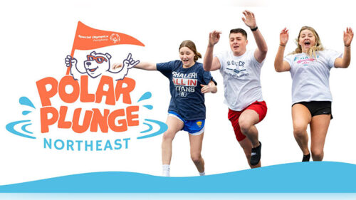 Participants jumping into icy water during the Northeast Polar Plunge at Montage Mountain Resorts in Scranton, PA, with the “Polar Plunge Northeast” Special Olympics logo visible.