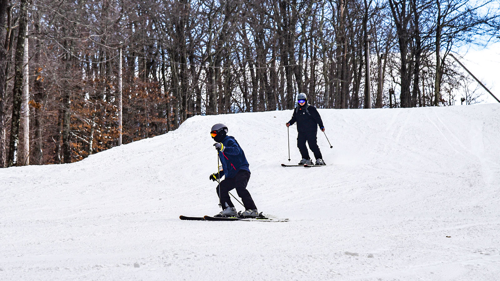 Skiers descend a groomed trail at Shawnee Mountain Ski Area in East Stroudsburg, PA.