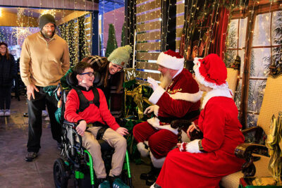 A boy smiles as he meets Santa during the Merry and Bright event at Marywood University in Scranton, PA.