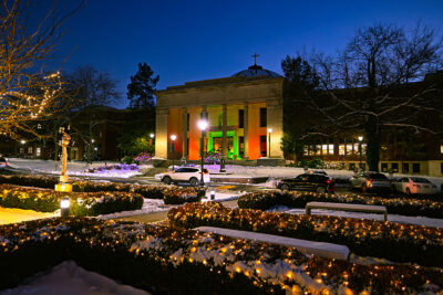 The rotunda glows with red and green lights in the night during the Merry and Bright event at Marywood University in Scranton, PA.
