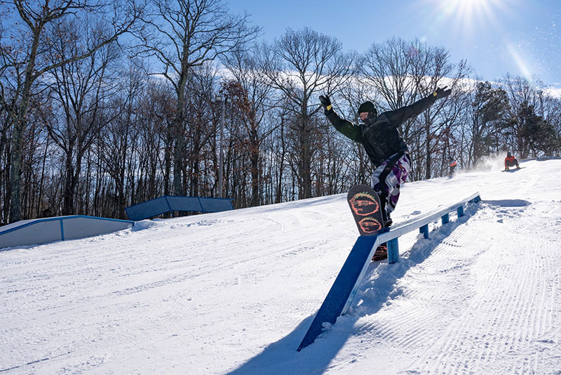 A snowboarder rides a rail feature in the terrain park at Shawnee Mountain Ski Area in East Stroudsburg, PA.