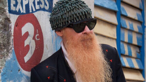 Billy F. Gibbons wearing sunglasses, a knit cap, and a long beard, appearing at the F.M. Kirby Center in Wilkes-Barre, PA.