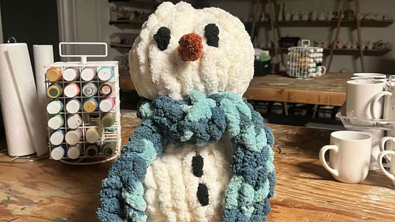 A small knit snowman from the Cozy hand knit snowman workshop at Back Mountain Makery in Dallas, PA.