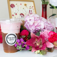 A table set with coffee and floral bouquet at Abide Coffee house in Wilkes-Barre, PA.