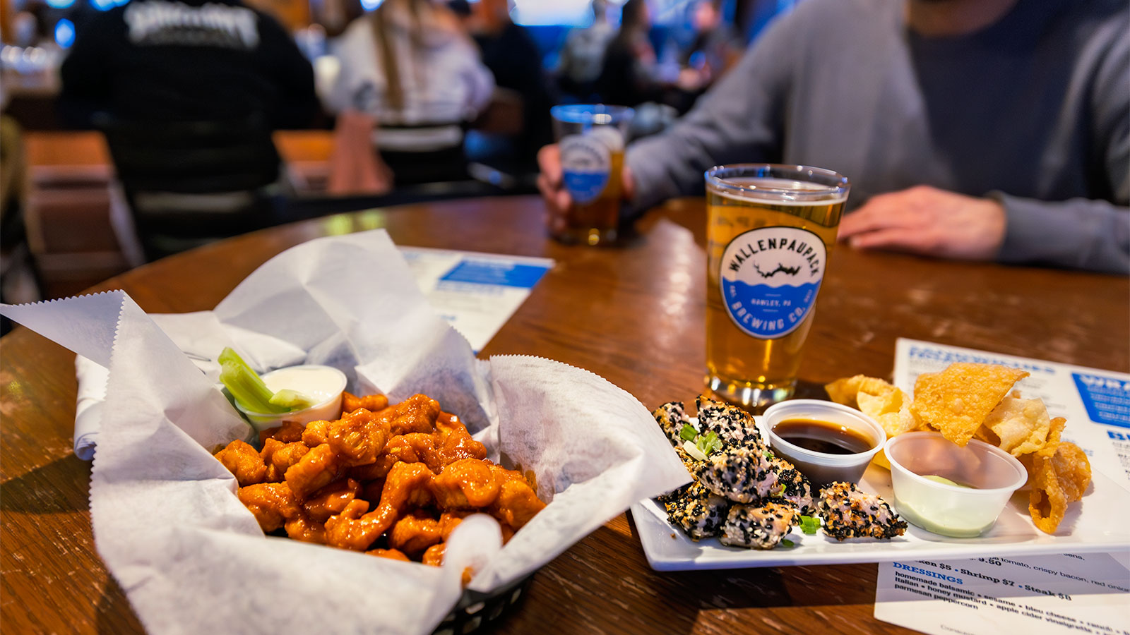 Late night bar food and a pint of beer on a table at Brews Brothers in Pittston, PA.
