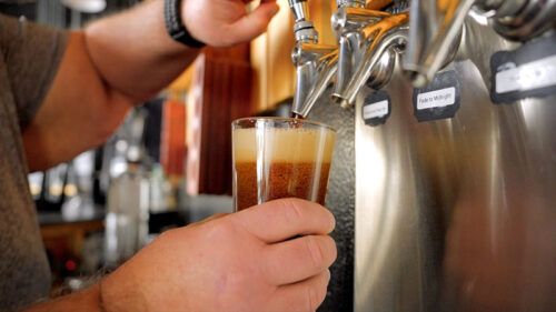 Reticence Winter Warmer pouring from a tap into a pint glass