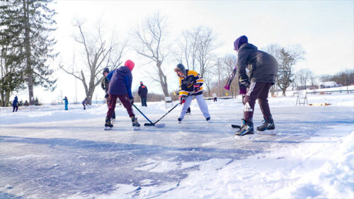 Boys playing hockey on the outdoor ice rink at Hillside Park in South Abington Twp., PA.