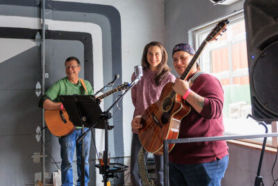 A woman gives a thank you speech on stage during the Shiverfest after party at Groove Brewing in Scranton, PA.