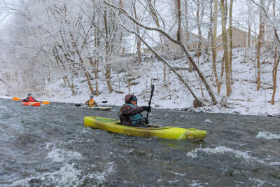 A kayaker takes on some rapids in his canoe during Shiverfest in Scranton, PA.