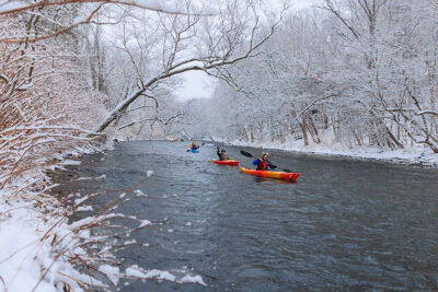 A group of kayakers make their way down the Lackawanna River during Shiverfest in Scranton, PA.
