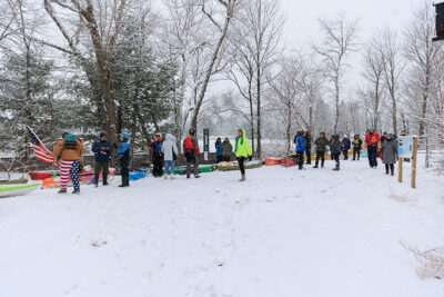 A wide view of the kayakers gearing up to head into the Lackawanna River during Shiverfest in Scranton, PA.