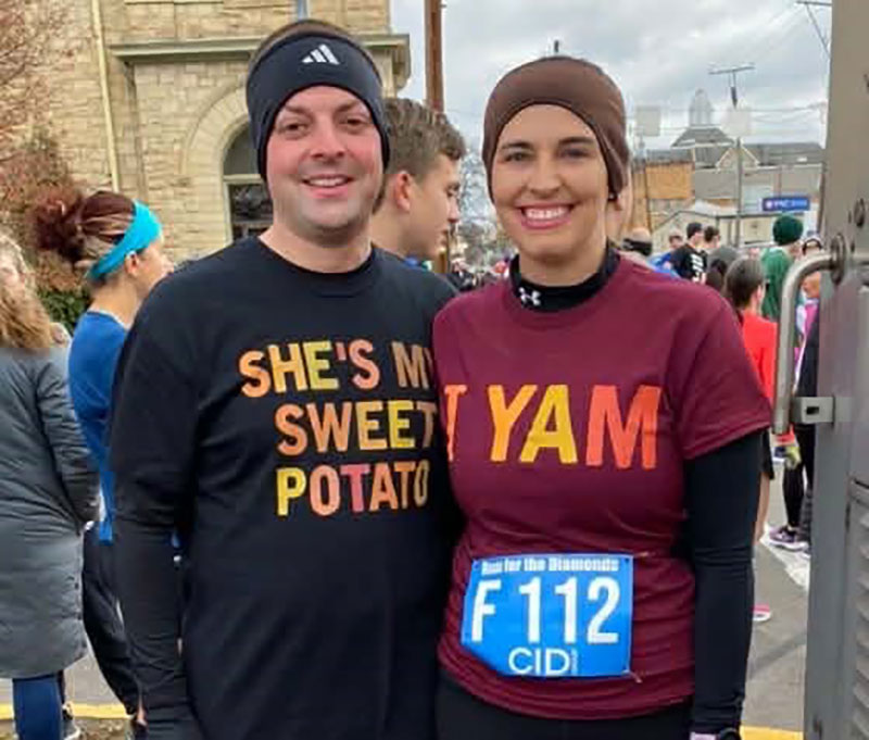 A couple smiles during a race with the Wyoming Valley Striders. 