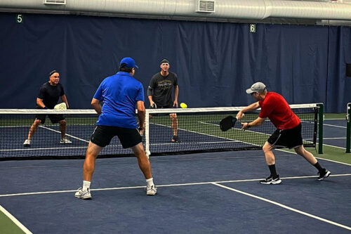 A group plays indoor pickleball at the Birchwood Racquet Club in Clarks Summit, PA.