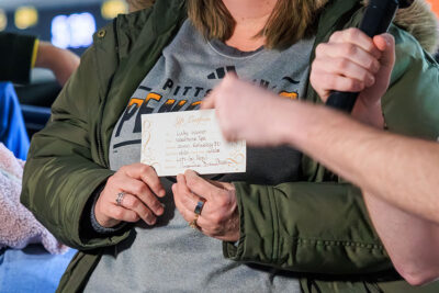 A woman wins a gift certificate to the Woodhouse Spa at the WIlkes-Barre/Scranton Penguins game in Wilkes-Barre, PA.