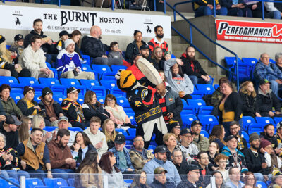 Tux, the Scranton/Wilkes-Barre Penguins mascot, bangs a drum amping up the crowd at the WIlkes-Barre/Scranton Penguins game in Wilkes-Barre, PA.