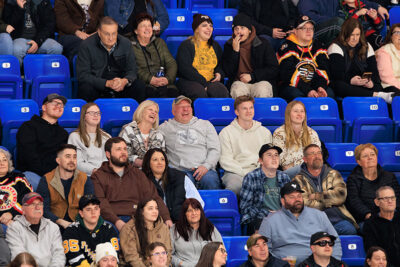 A crowd laughs watching the jumbotron at the WIlkes-Barre/Scranton Penguins game in Wilkes-Barre, PA.