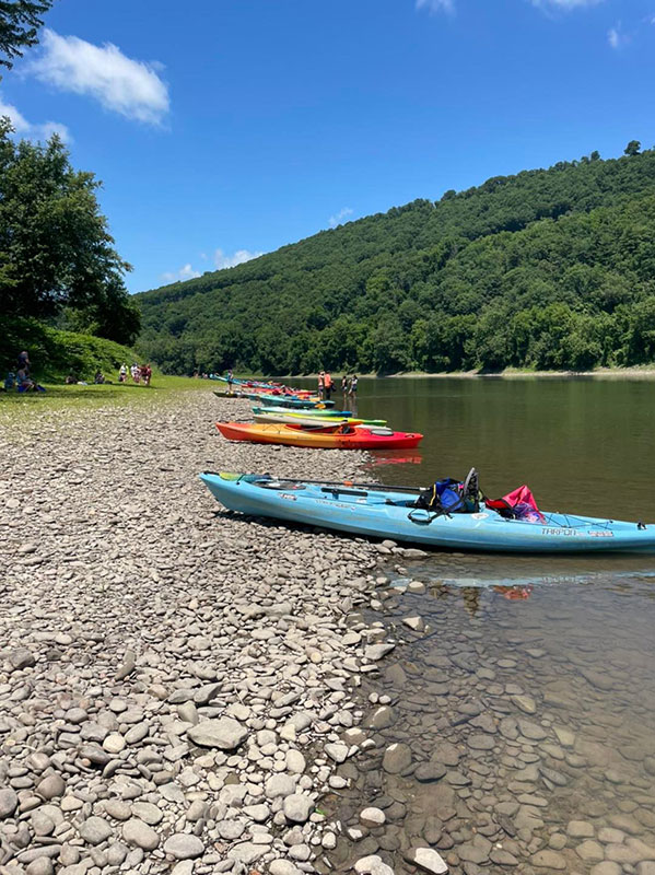 Kayaks beached on the shore of the Susquehanna River in Sugar Run, PA.