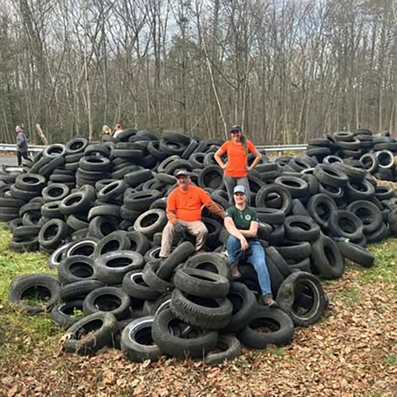 Eastern Pennsylvania Coalition for Abandoned Mine Reclamation volunteers collect discarded tires. 