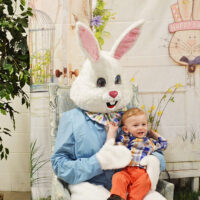 The Easter Bunny holding a small boy to promote the Easter Bunny Brunch Buffet & Egg Hunt at Pocono Organics in Long Pond, PA.