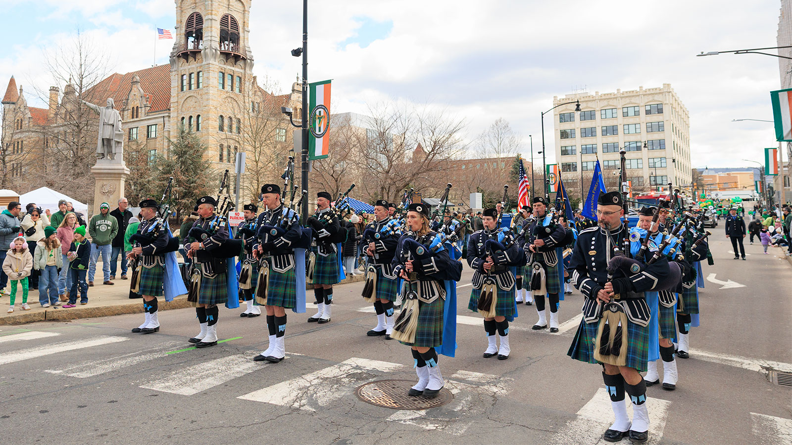 A group of bagpipers march their way down the street during the St. Patrick's Day parade in Scranton, PA.