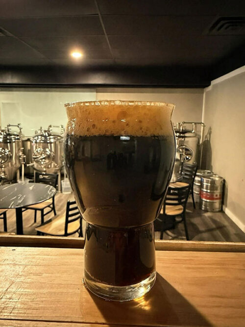 A pint of stout on the bar at Anomaly Craft Brewing in Berwick, PA.