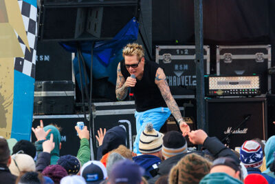 Mark McGrath, lead singer of Sugar Ray, slaps hands with the crowd at Mountainfest at Montage Mountain in Moosic, PA.