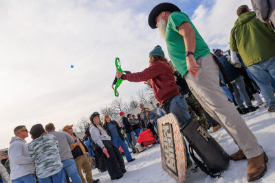 A man shoots a jello shot out of a bow into the crowd at Mountainfest at Montage Mountain in Moosic, PA.