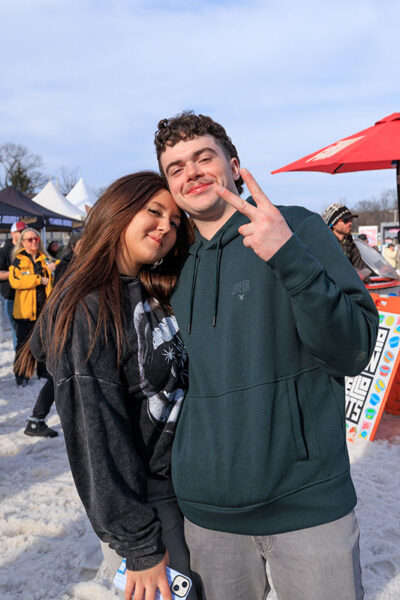 A couple give a peace sign to the camera at Mountainfest at Montage Mountain in Moosic, PA.