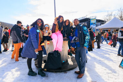 A family of five wave to the camera at Mountainfest at Montage Mountain in Moosic, PA.