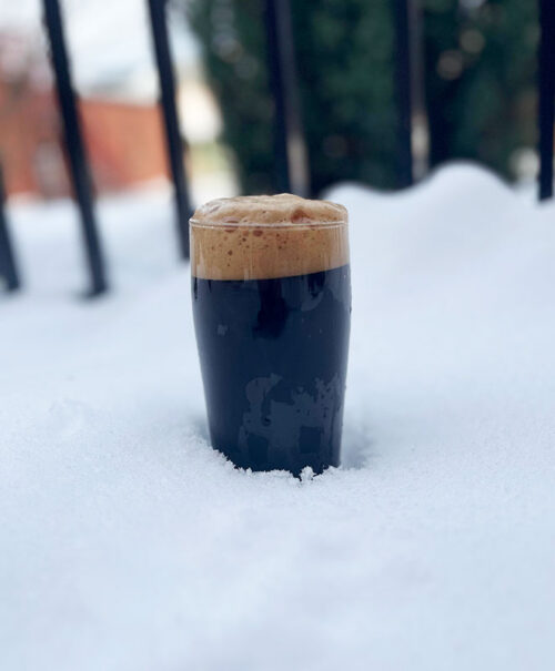 A lone pint of stout in the snow outside Blind cat Beer Co. in Pittston, PA.