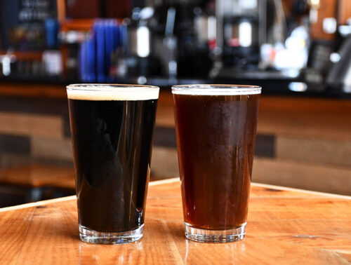 Two pints of beer on a table at Barley Creek Brewing Company in tannersville, PA.