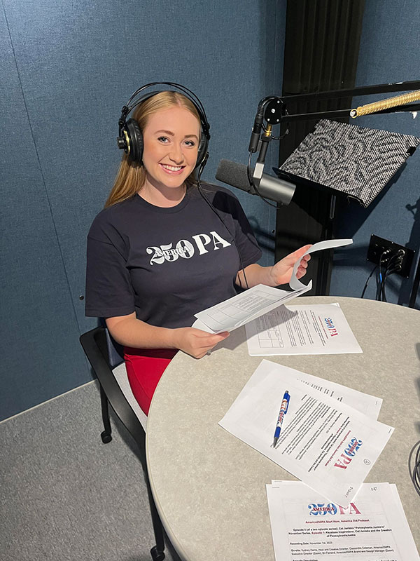 Start Here, America Did! podcast host, Sydney Harris-White poses for a photo.