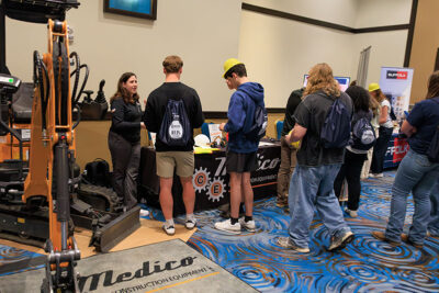 High school students interact with an employer booth featuring construction equipment and hands on demonstrations at a career exploration event at the Mohegan Pennsylvania Convention Center in Wilkes-Barre, PA.