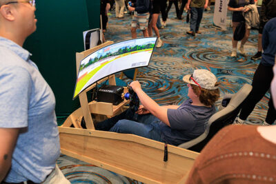 Students test drive a virtual racetrack during a career exploration event at the Mohegan Pennsylvania Convention Center in Wilkes-Barre, PA.