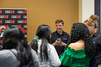 A representative from Cumulus Radio interacts with students during a career exploration event at the Mohegan Pennsylvania Convention Center in Wilkes-Barre, PA.