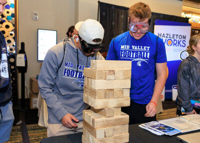 Students particpate in a giant game of Jenga during a career exploration event at the Mohegan Pennsylvania Convention Center in Wilkes-Barre, PA.
