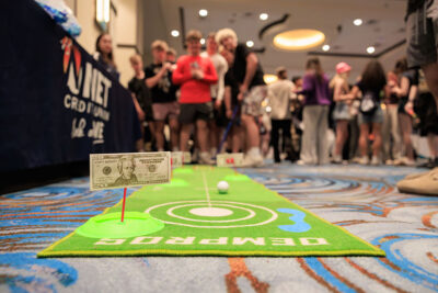 Students play mini golf for a chance to win money during a career exploration event at the Mohegan Pennsylvania Convention Center in Wilkes-Barre, PA.