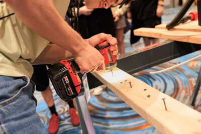 A student drills into a two by four during a career exploration event at the Mohegan Pennsylvania Convention Center in Wilkes-Barre, PA.