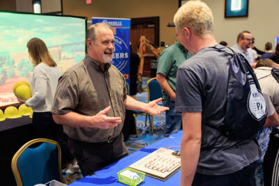 A representative from Mericle Construction speak with students during a career exploration event at the Mohegan Pennsylvania Convention Center in Wilkes-Barre, PA.