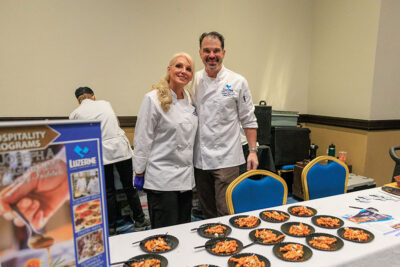 Two chefs from Luzerne County Community College smile for a photo during a career exploration event at the Mohegan Pennsylvania Convention Center in Wilkes-Barre, PA.
