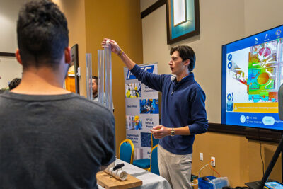 High school students interact with an employer booth featuring aerodynamics at a career exploration event at the Mohegan Pennsylvania Convention Center in Wilkes-Barre, PA.