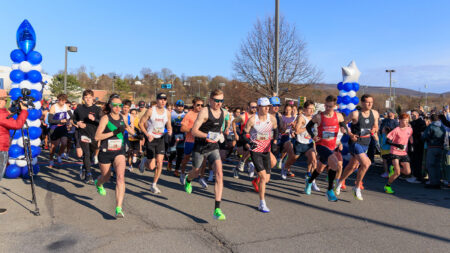 A group of runners take of from the starting line during the Scranton half marathon in Scranton, PA.
